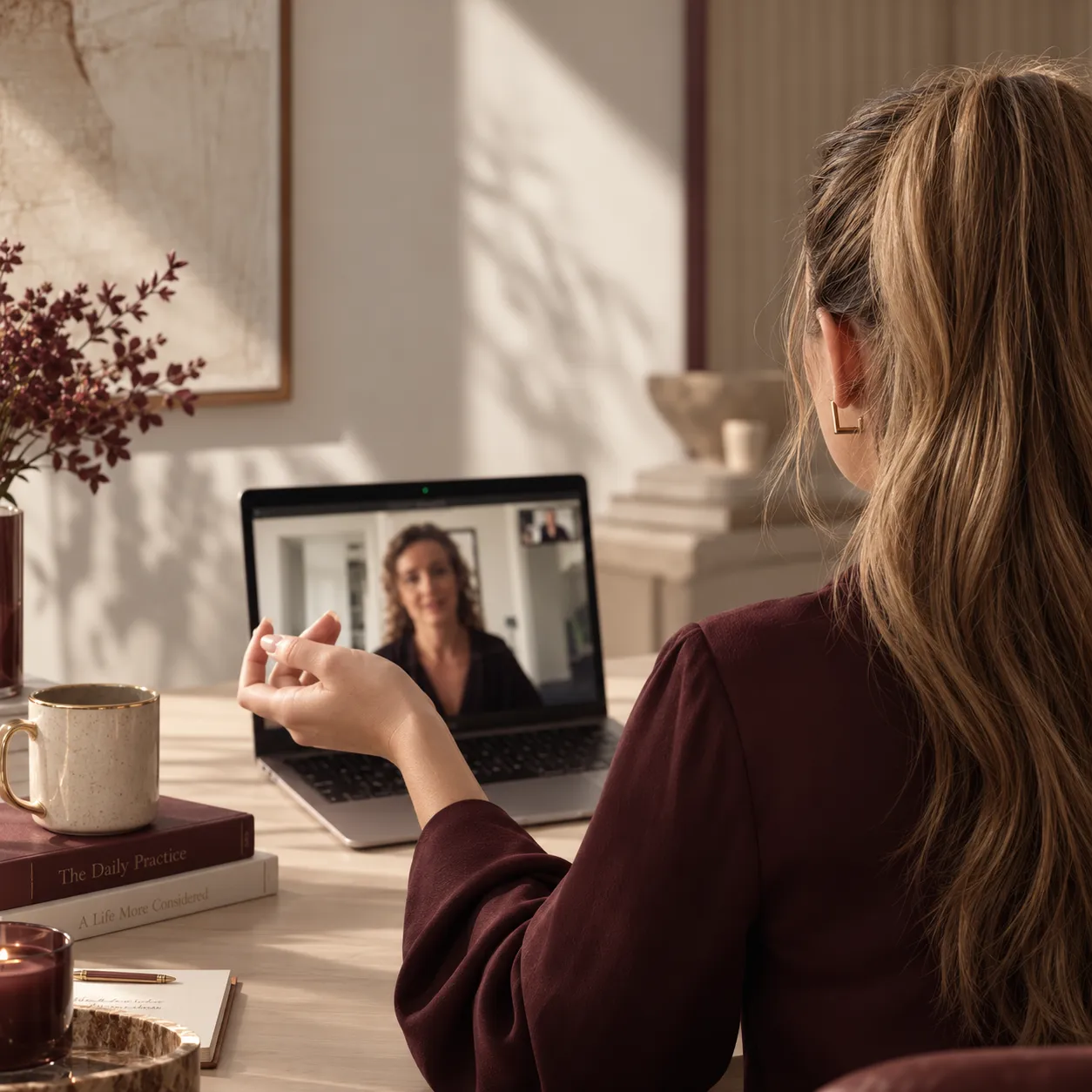 A supervisor in an online session at her desk